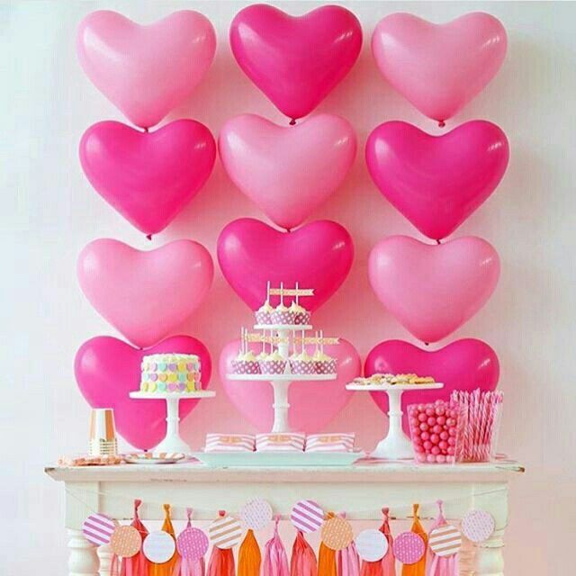 heart shaped balloons backdrop of party